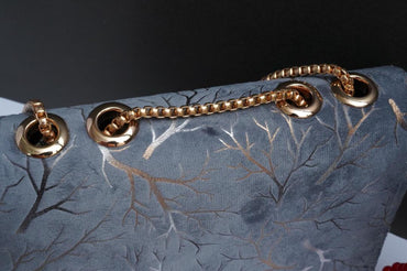 Woman's velvet Textured purse with chain
